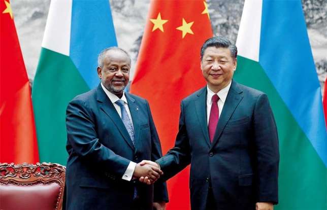 Chinese President Xi Jinping shakes hands with Djibouti's President Ismail Omar Guelleh