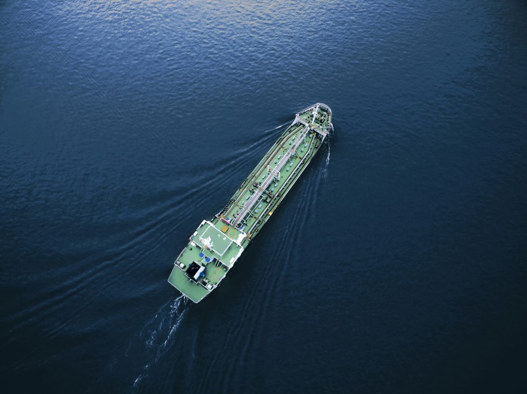 Aerial Top View Tanker Ship Park In Sea .